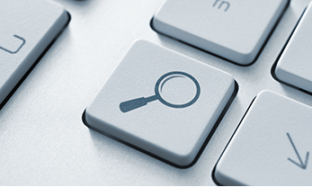 Keyboard key with magnifying glass