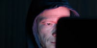Woman against wall looking scared